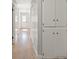 Hallway featuring hardwood floors, neutral color palette and built-in storage cabinets at 4204 El Jardin Ave, Las Vegas, NV 89102