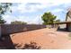 Spacious backyard features a desert landscape, block wall, and covered patio, providing a canvas for outdoor enjoyment at 4335 Twin Peaks Dr, North Las Vegas, NV 89032