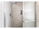 Close up of the bathroom featuring a glass enclosed shower with tile surround at 4335 Twin Peaks Dr, North Las Vegas, NV 89032