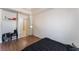 A clean bedroom featuring wood floors and a closet at 4335 Twin Peaks Dr, North Las Vegas, NV 89032