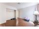 Spacious bedroom featuring wood-look floors and a built-in closet at 4335 Twin Peaks Dr, North Las Vegas, NV 89032