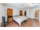 Spacious bedroom with wood floors, two closets, and a ceiling fan at 4335 Twin Peaks Dr, North Las Vegas, NV 89032