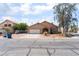 A charming single-story home with a well-maintained yard and attached two-car garage at 4335 Twin Peaks Dr, North Las Vegas, NV 89032