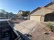 Charming single-Gathering home with a two-car garage and a well-manicured front yard at 4335 Twin Peaks Dr, North Las Vegas, NV 89032