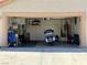 View of the two car garage with a motorcycle and other storage items, providing ample space for parking and storage at 4335 Twin Peaks Dr, North Las Vegas, NV 89032