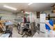Garage with a trailer, storage shelving, and various household items at 4335 Twin Peaks Dr, North Las Vegas, NV 89032