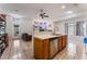 Eat-in kitchen with a breakfast bar, stainless steel dishwasher, and tile floors at 4335 Twin Peaks Dr, North Las Vegas, NV 89032