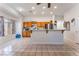 Spacious eat-in kitchen featuring an island, stainless steel refrigerator, and tile flooring at 4335 Twin Peaks Dr, North Las Vegas, NV 89032