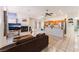 Open living space with tiled floors, fireplace, and oak cabinets in the kitchen at 4335 Twin Peaks Dr, North Las Vegas, NV 89032