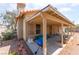 Inviting covered patio is ideal for outdoor relaxation and entertainment with access to yard and mature trees at 4335 Twin Peaks Dr, North Las Vegas, NV 89032