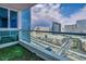 Relax on this cozy balcony with synthetic grass, offering panoramic cityscape vistas and blue window reflection at 4525 Dean Martin Dr # 2903, Las Vegas, NV 89103