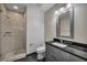 Well-lit bathroom featuring a glass-enclosed shower and vanity with sleek, modern finishes at 4525 Dean Martin Dr # 2903, Las Vegas, NV 89103