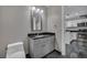 Modern bathroom with sleek vanity and view into an adjacent kitchen space at 4525 Dean Martin Dr # 2903, Las Vegas, NV 89103