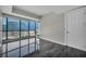 Bedroom with large windows, gray walls and black tiled floors at 4525 Dean Martin Dr # 2903, Las Vegas, NV 89103