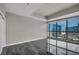 Modern bedroom with floor-to-ceiling windows offering amazing city views and tiled floor at 4525 Dean Martin Dr # 2903, Las Vegas, NV 89103