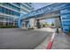 Exterior shot of the building entrance showing covered drop-off and blue facade at 4525 Dean Martin Dr # 2903, Las Vegas, NV 89103