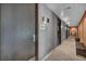 Elegant hallway leading to the women's spa with tiled floors and decorative lighting at 4525 Dean Martin Dr # 2903, Las Vegas, NV 89103