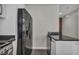 Modern kitchen features black stainless appliances and sleek dark countertops at 4525 Dean Martin Dr # 2903, Las Vegas, NV 89103