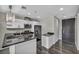 Well-appointed kitchen featuring sleek black countertops, stainless steel appliances, and contemporary white cabinetry at 4525 Dean Martin Dr # 2903, Las Vegas, NV 89103