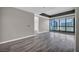 Bright living room with hardwood floors and floor to ceiling windows at 4525 Dean Martin Dr # 2903, Las Vegas, NV 89103