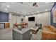Lounge area with comfortable seating, dining table, TV, and kitchenette at 4525 Dean Martin Dr # 2903, Las Vegas, NV 89103