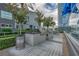 Outdoor kitchen and dining area with stainless steel grills and manicured landscaping at 4525 Dean Martin Dr # 2903, Las Vegas, NV 89103
