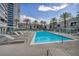 Relax and unwind by the community pool with comfortable lounge chairs and lush landscaping at 4525 Dean Martin Dr # 2903, Las Vegas, NV 89103