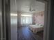 Spacious bedroom with large windows, plush bedding, and a relaxing ambiance with hard surface flooring at 4764 Wild Draw Dr, North Las Vegas, NV 89031