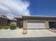 Charming single story home featuring an attached two car garage and desert landscaping at 4764 Wild Draw Dr, North Las Vegas, NV 89031