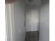 Narrow hallway with neutral walls and hard surface flooring featuring a closet space at 4764 Wild Draw Dr, North Las Vegas, NV 89031