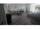 Open-concept living area with stylish dark gray flooring, contemporary furnishings, and abundant natural light at 4764 Wild Draw Dr, North Las Vegas, NV 89031