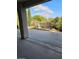 Covered back patio with concrete and beautiful landscaping at 5110 Silenzio St, Las Vegas, NV 89135