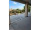 Wide view of the backyard with native landscaping, rock ground cover and covered patio at 5110 Silenzio St, Las Vegas, NV 89135