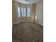 Bedroom featuring bay windows, neutral walls, and carpeted floor at 5110 Silenzio St, Las Vegas, NV 89135