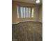 Spacious bedroom with plush carpet and a bay window at 5110 Silenzio St, Las Vegas, NV 89135