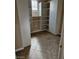 Walk-in closet with custom white shelving and storage providing organization and convenience at 5110 Silenzio St, Las Vegas, NV 89135