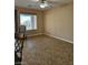 Bright dining area with tile flooring, a large window, and neutral paint, creating a cozy atmosphere at 5110 Silenzio St, Las Vegas, NV 89135