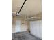 Spacious garage with overhead racks and installed storage cabinets at 5110 Silenzio St, Las Vegas, NV 89135