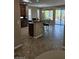 Open concept kitchen with a breakfast bar and access to the outdoor patio at 5110 Silenzio St, Las Vegas, NV 89135