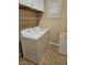 Functional laundry room with washer, dryer, storage cabinets, and a window for natural light at 5110 Silenzio St, Las Vegas, NV 89135