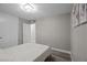 Neutral bedroom with luxury vinyl floors, closet, and a view to the hallway at 5375 Chestnut St, Las Vegas, NV 89119