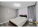 Bedroom features luxury vinyl floors, a decorative crystal chandelier, and plush accents at 5375 Chestnut St, Las Vegas, NV 89119