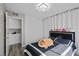 Cozy bedroom featuring luxury vinyl floors, plush stuffed animals, and a built-in cabinet at 5375 Chestnut St, Las Vegas, NV 89119