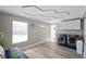 Bright laundry room features a modern washer and dryer, storage cabinets, and wood-look flooring at 5375 Chestnut St, Las Vegas, NV 89119