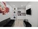 This living room features a television, modern decor and conveniently located in-unit laundry at 5375 Chestnut St, Las Vegas, NV 89119