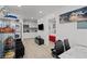 Open-concept living space features in-unit laundry, a modern kitchen, and a glimpse into the bedroom at 5375 Chestnut St, Las Vegas, NV 89119