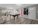 Spacious living room featuring a billiards table and modern design elements at 5375 Chestnut St, Las Vegas, NV 89119