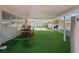Spacious covered patio with artificial turf offers a cozy outdoor retreat for dining and recreation at 5375 Chestnut St, Las Vegas, NV 89119