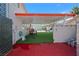 Artificial turf defines a generously covered patio, perfect for dining and enjoying the outdoor space at 5375 Chestnut St, Las Vegas, NV 89119