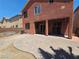 The backyard features a paved patio, a covered porch, and an adjacent yard at 5419 Brass Hills Ct, Las Vegas, NV 89122
